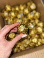 Цукерки у формі кулі молочний шоколад з гірким праліне та злаками Melbon 100 г